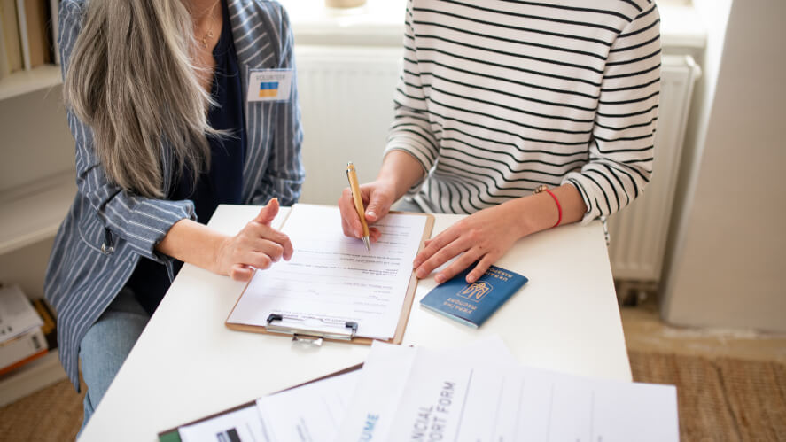 People Signing Contracts for Grants