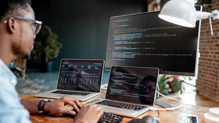 A developer coding with multiple languages