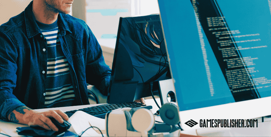 Indie game programmer coding in front of dual monitors in a professional development environment with GamesPublisher.com branding.